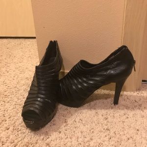 Black zip up high heels